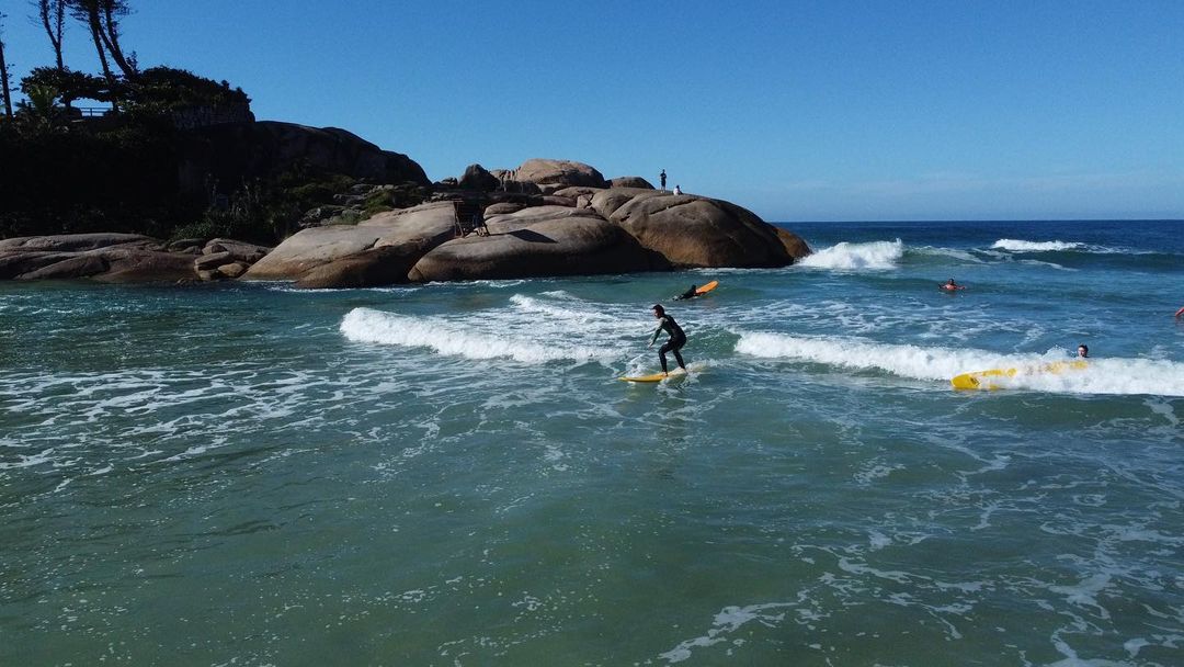 Us surfing while traveling through Floripa, Brazil. 