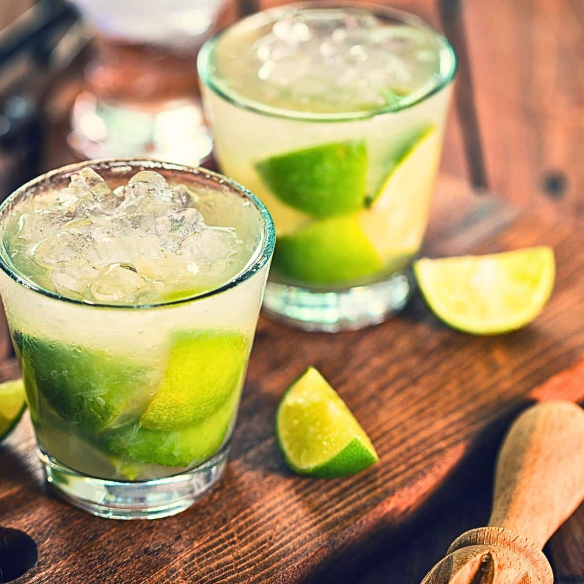 Brazilian locals mixing Caipirinha for festive holiday drinks