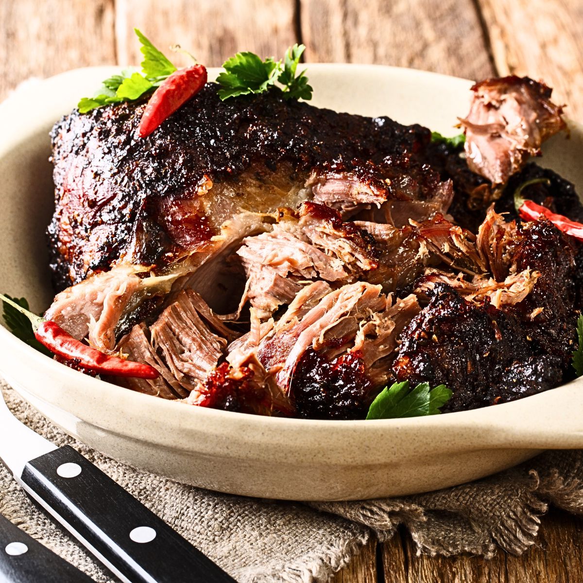 Local Brazilians preparing pernil, a Christmas specialty.