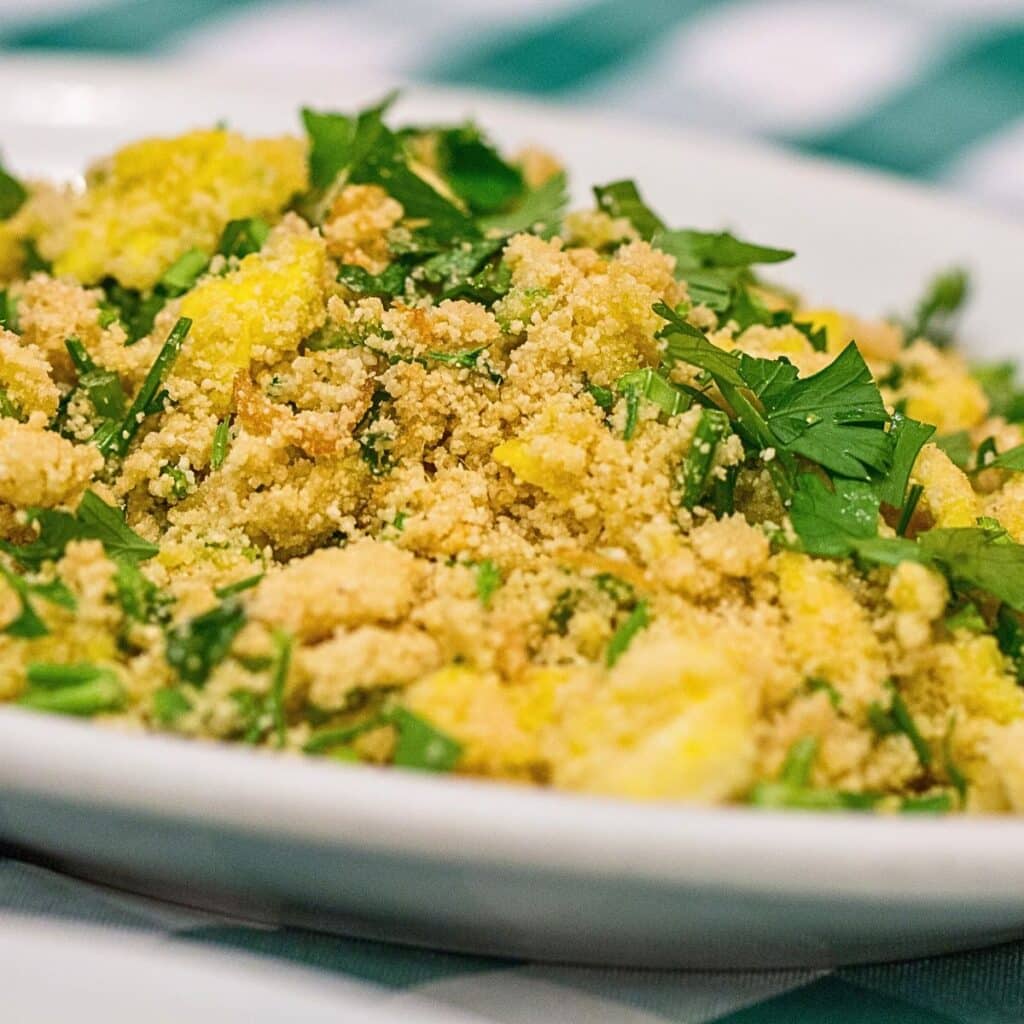 Homemade Brazilian Farofa, a savory side dish of toasted cassava flour with sausage and spices, from our family’s Christmas celebration.