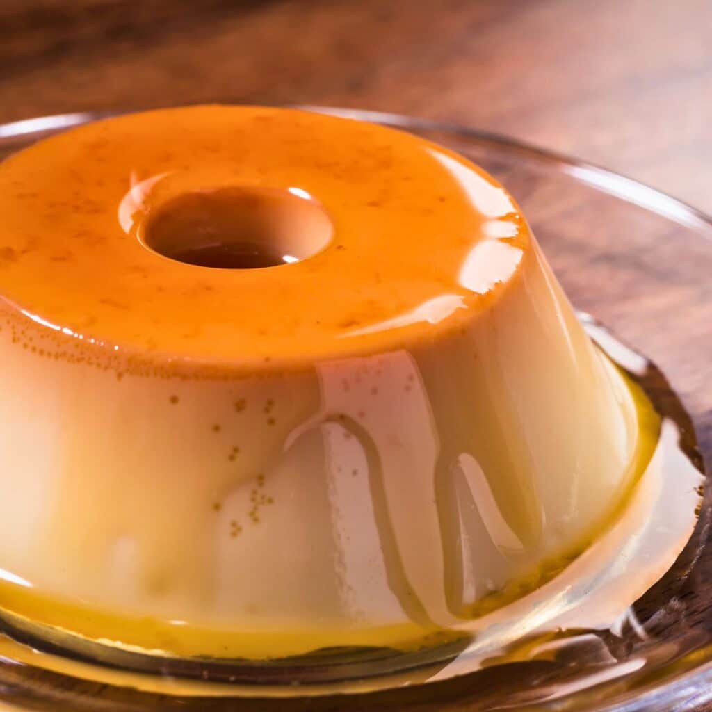 Homemade Brazilian Milk Pudding, a holiday favorite with a perfect caramel glaze, from our Christmas dessert table.