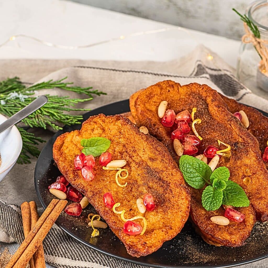 Homemade Rabanada in Brazil, deliciously soaked in milk and eggs, then fried to perfection, served during our festive holiday feast.